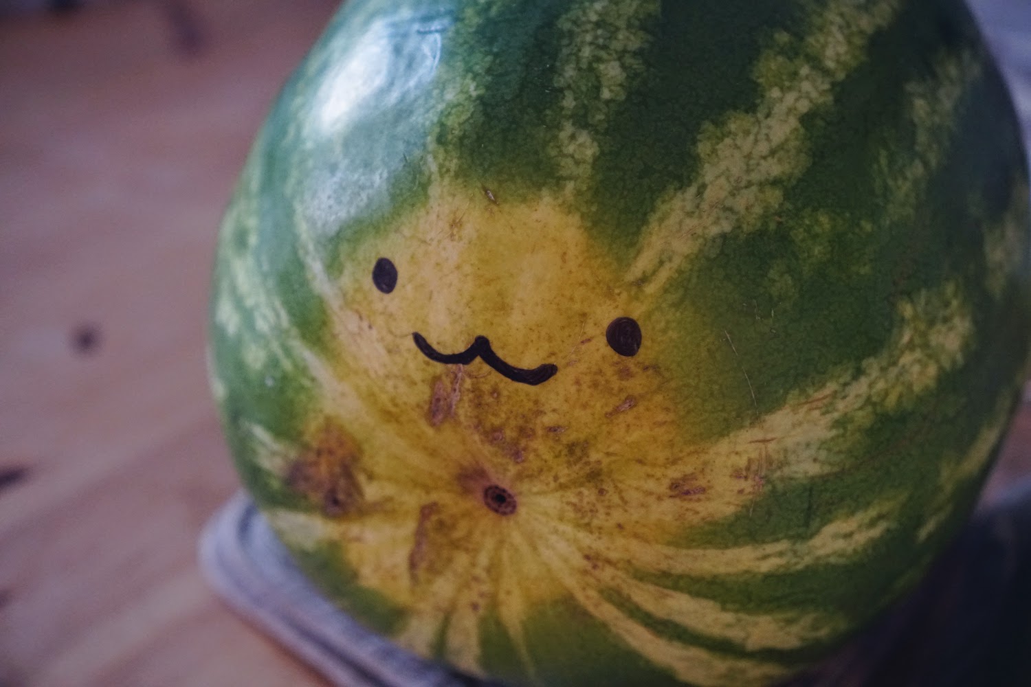 A watermelon with a cute face